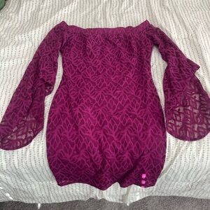 Magenta/ Dark pink Bebe short dress with long sleeves.